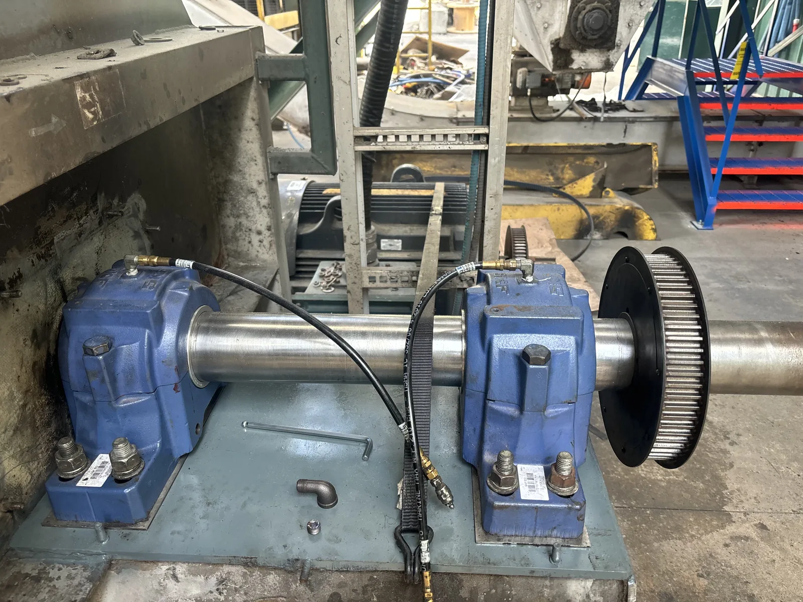 Millwright performing alignment check on newly installed industrial machinery — Raider Industrial BC